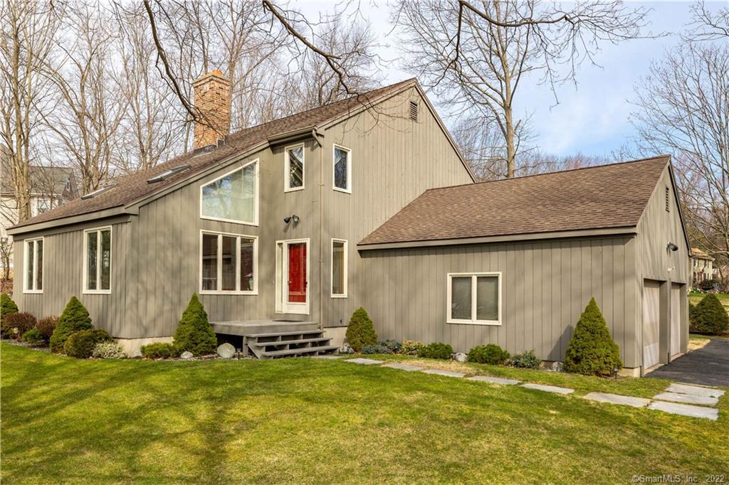 257 Hart Street Bristol, CT 06010 - Photo 1 of 1 a backyard of a house with yard fire pit and outdoor seating