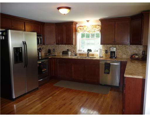 67 Maple Street Coventry, RI 02816 - Photo 4 of 12 Kitchen. Cherry cabinets, granite counters and hardwood floors all installed in 2010. Mint condition.