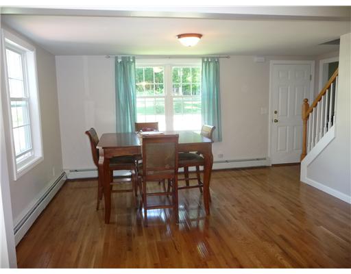 67 Maple Street Coventry, RI 02816 - Photo 6 of 12 Living Room. Large room filled with sun light can be living room or dining room.