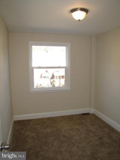 5152 Stafford Road Baltimore, MD 21229 - Photo 13 of 22 an empty room with a window