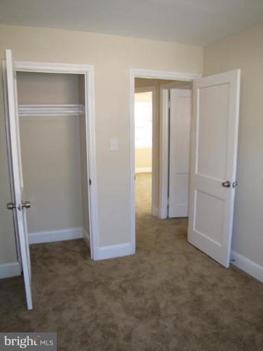 5152 Stafford Road Baltimore, MD 21229 - Photo 14 of 22 a view of an empty room with closet area