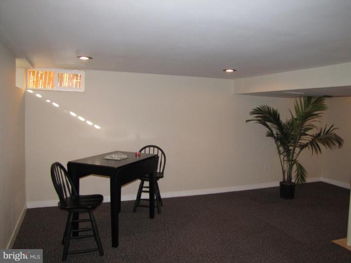 5152 Stafford Road Baltimore, MD 21229 - Photo 16 of 22 a view of a room with furniture and a potted plant