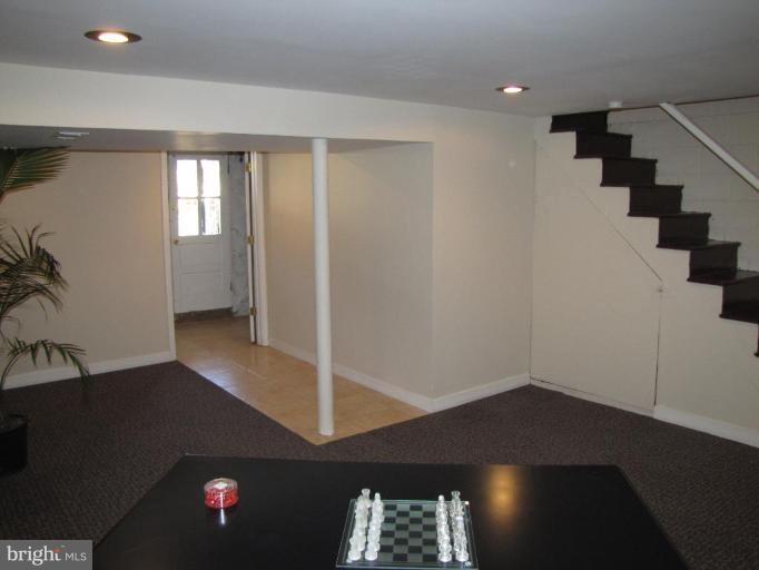 5152 Stafford Road Baltimore, MD 21229 - Photo 17 of 22 a view of entryway and hall with wooden floor