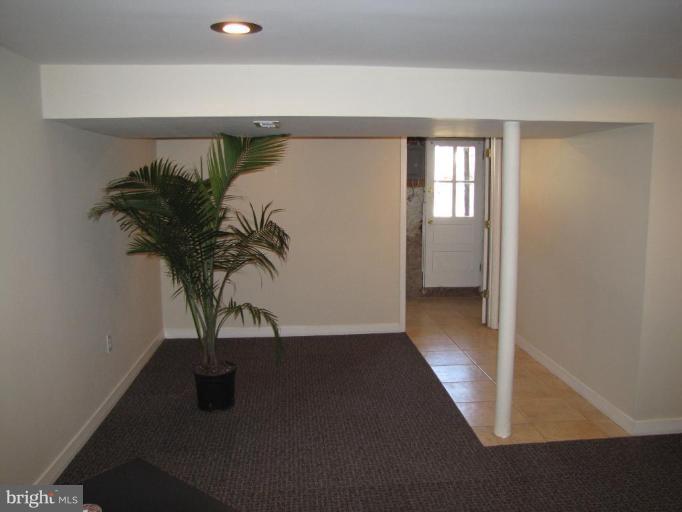 5152 Stafford Road Baltimore, MD 21229 - Photo 18 of 22 a view of a house with a potted plant