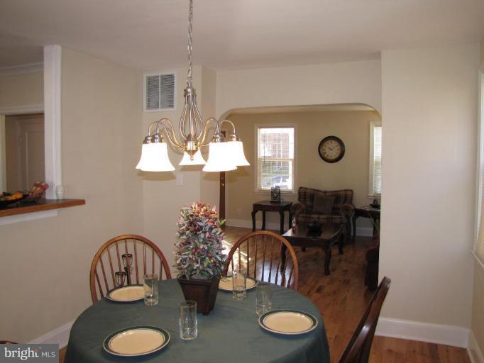 5152 Stafford Road Baltimore, MD 21229 - Photo 5 of 22 a view of a dining room with furniture and wooden floor