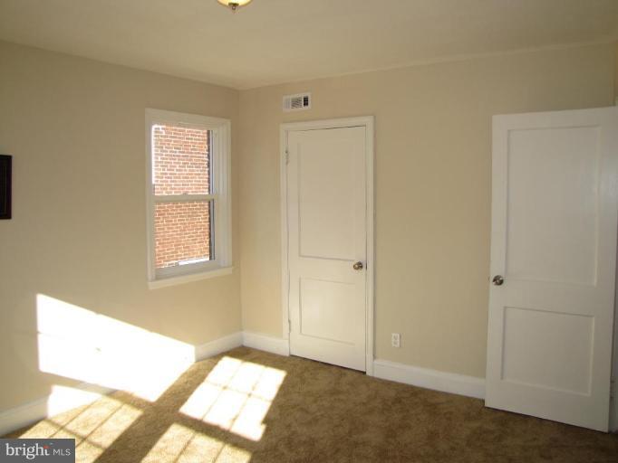 5152 Stafford Road Baltimore, MD 21229 - Photo 10 of 22 a view of an empty room and window