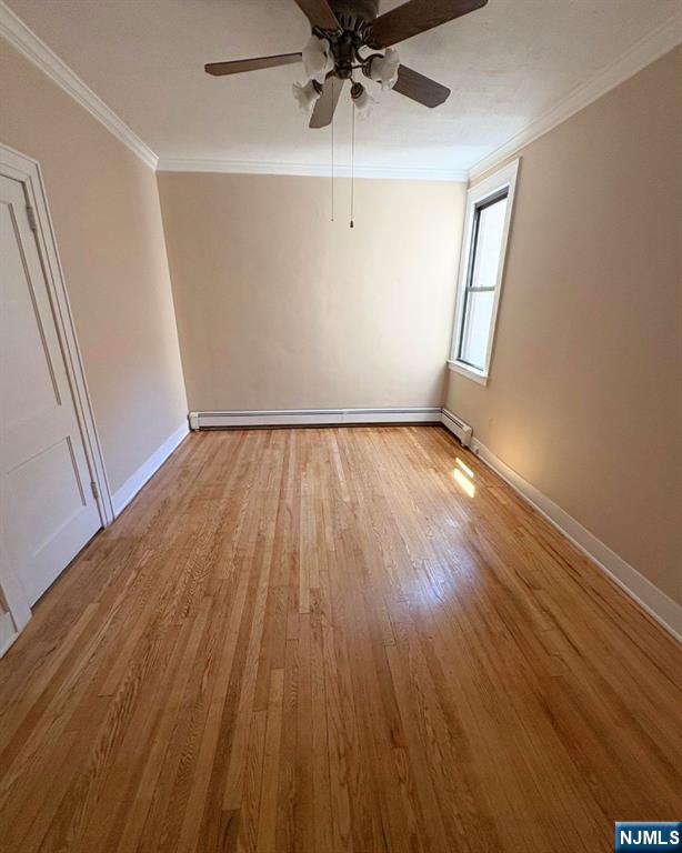 38 River Edge Road, Unit 40B River Edge, NJ 07661 - Photo 8 of 11 wooden floor in an empty room with a window