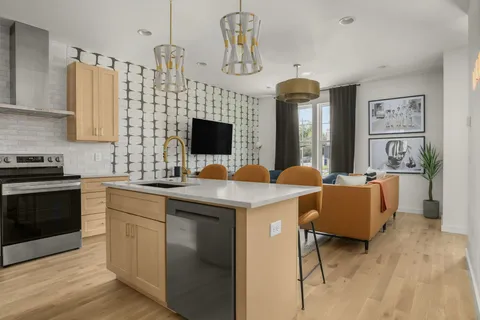 a kitchen with a sink cabinets and window