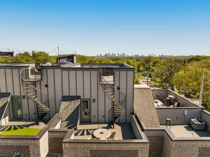 a view of a balcony with chairs