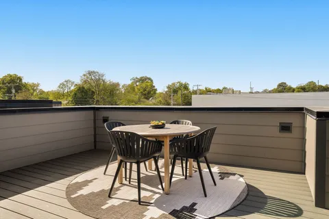 a view of city from terrace with seating space