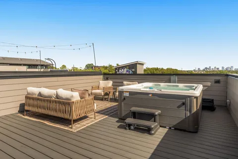 a view of a balcony with furniture