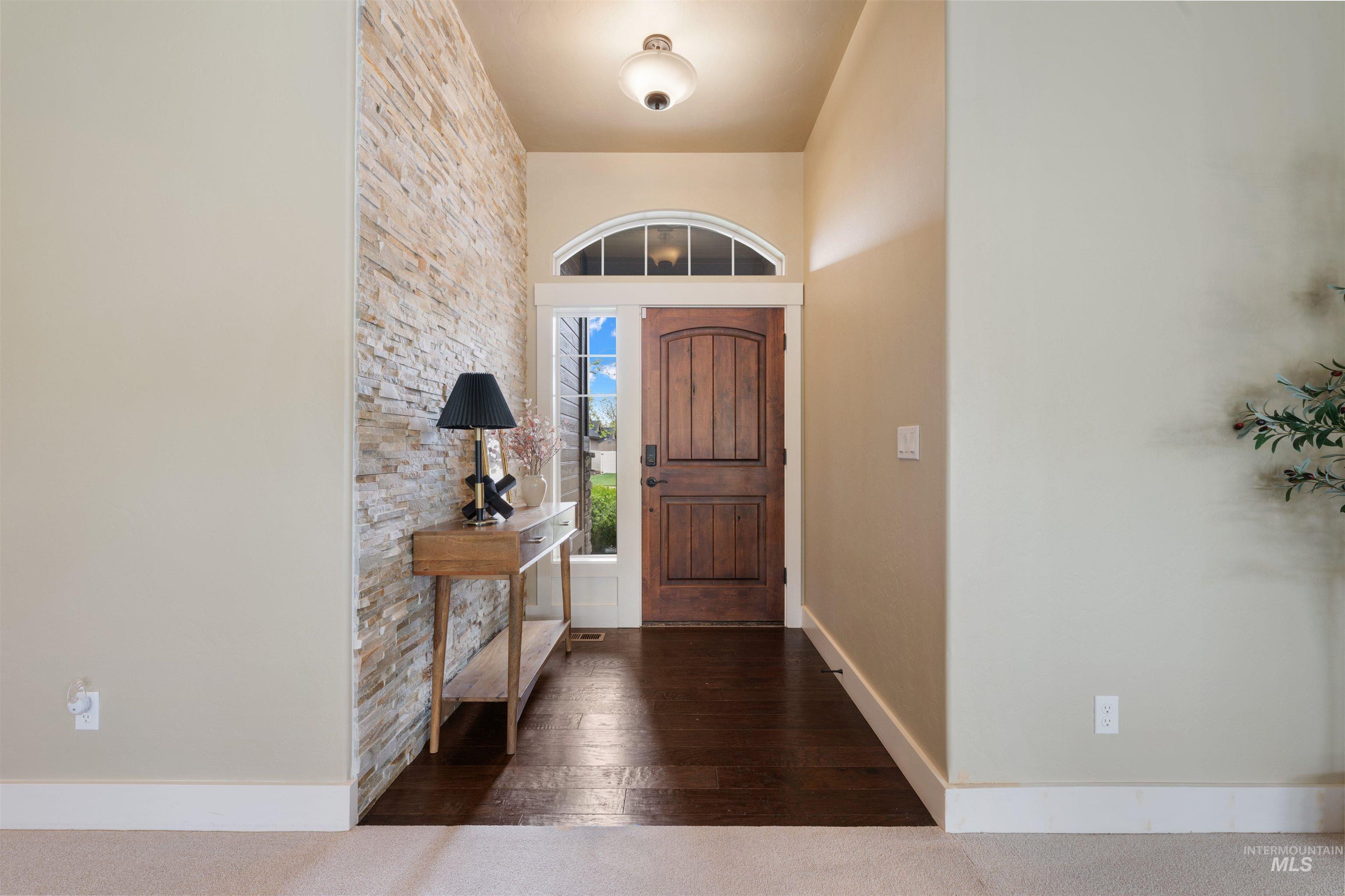 13571 Signorello Street Caldwell, ID 83607 - Photo 5 of 34 Hardwood floors, stone accent wall