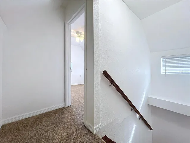 a view of hallway with stairs
