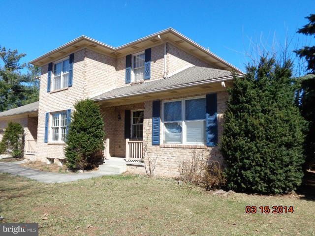 8069 Stone Ridge Drive Frederick, MD 21702 - Photo 1 of 13 a front view of a house with a yard