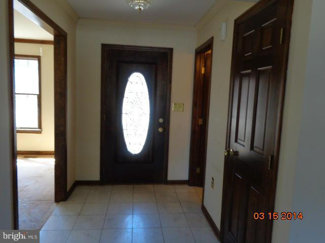 8069 Stone Ridge Drive Frederick, MD 21702 - Photo 2 of 13 an entryway door with a mirror