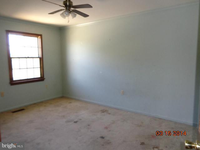 8069 Stone Ridge Drive Frederick, MD 21702 - Photo 11 of 13 an empty room with a window and a fan