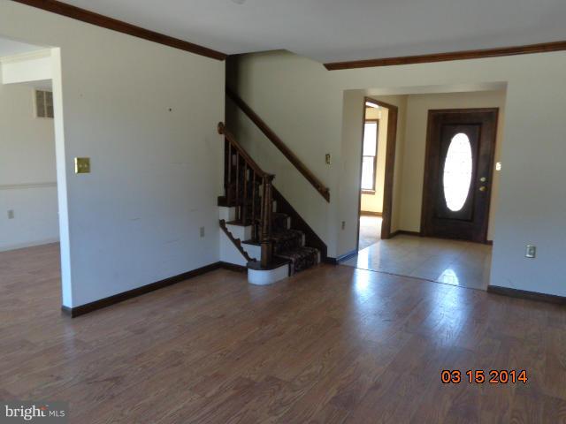 8069 Stone Ridge Drive Frederick, MD 21702 - Photo 5 of 13 a view of a livingroom with wooden floor and staircase