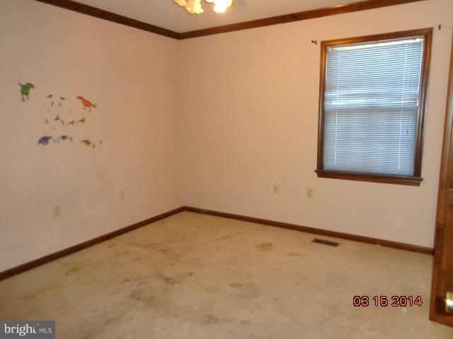 8069 Stone Ridge Drive Frederick, MD 21702 - Photo 8 of 13 a view of a small space with wooden floor and a window