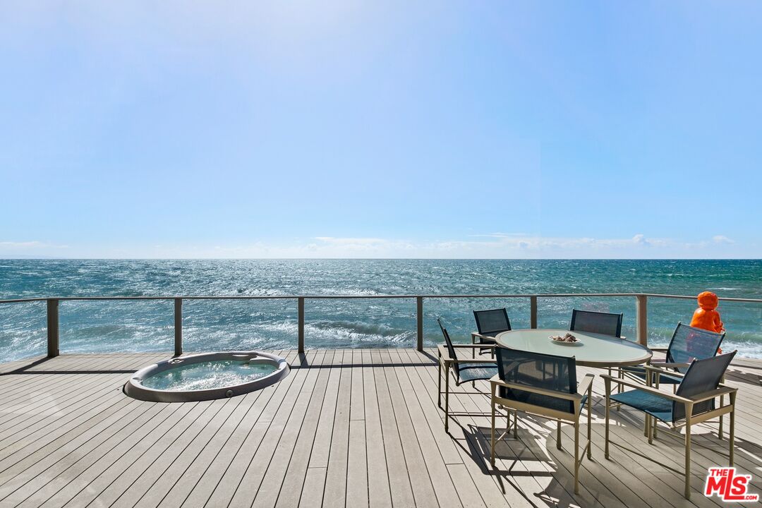 24254 Malibu Road Malibu, CA 90265 - Photo 12 of 26 a view of a terrace with furniture and stove