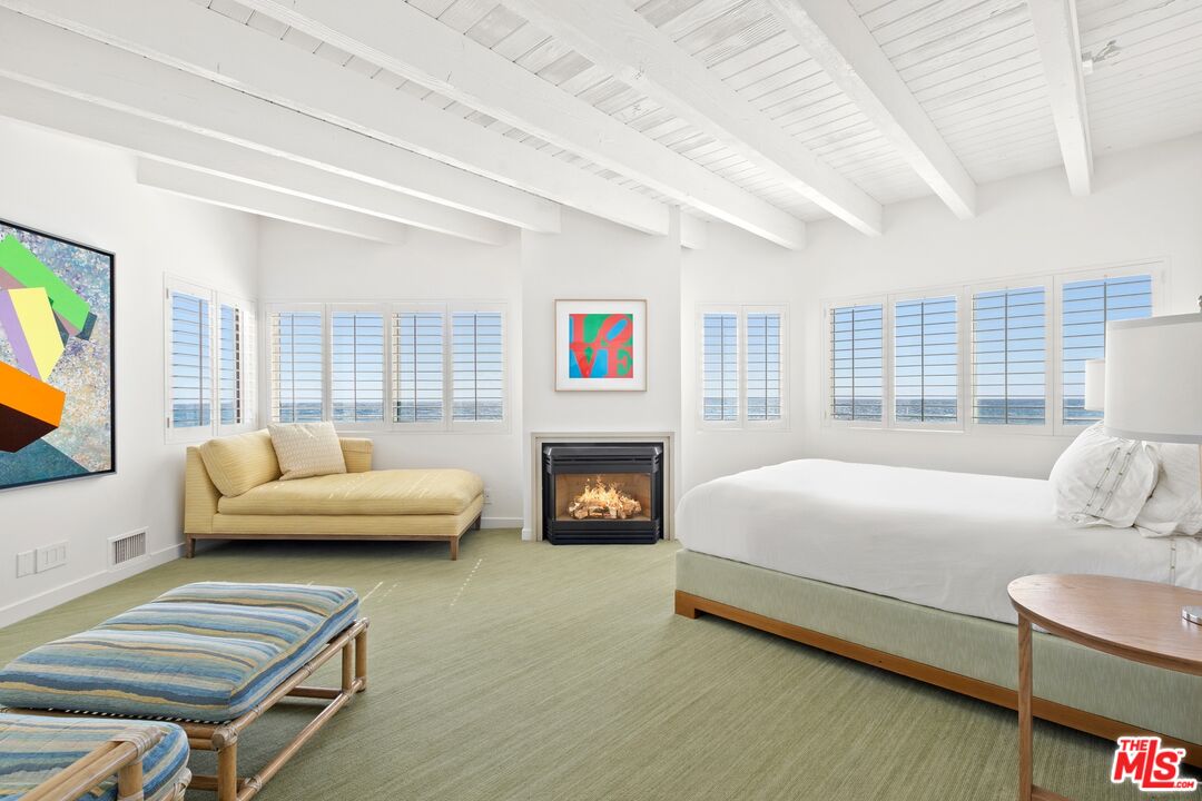 24254 Malibu Road Malibu, CA 90265 - Photo 16 of 26 a bed room with a bed and a couch