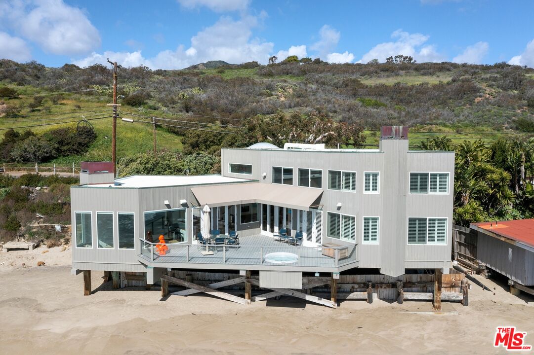 24254 Malibu Road Malibu, CA 90265 - Photo 24 of 26 a patio with hardwood table and chairs