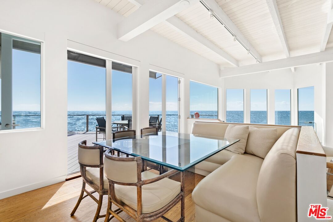 24254 Malibu Road Malibu, CA 90265 - Photo 5 of 26 a living room with furniture and a large window