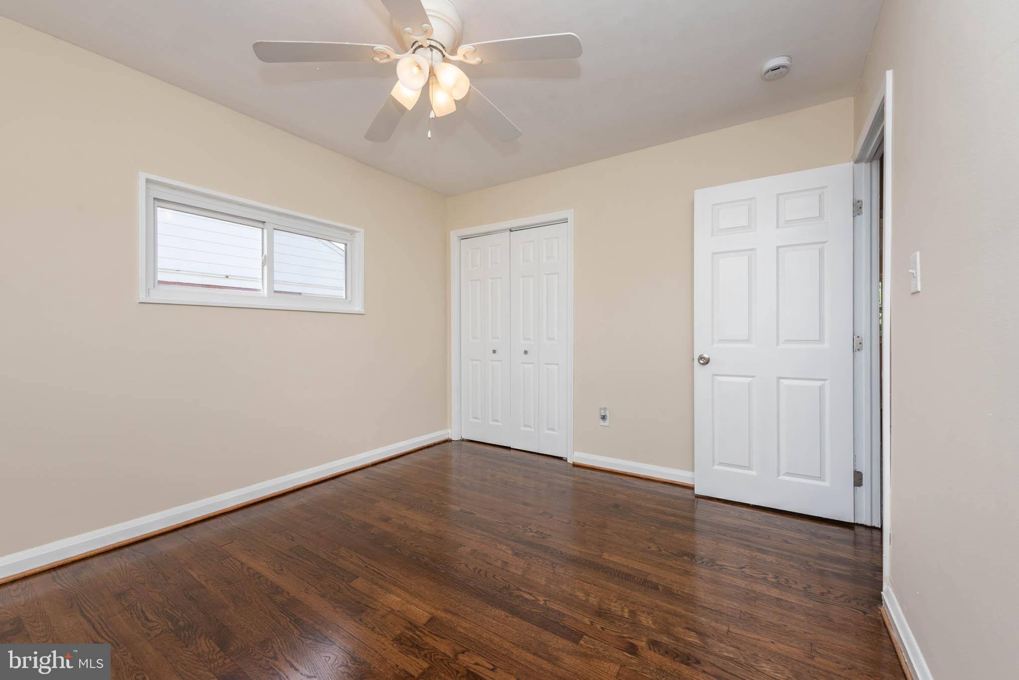 3300 Wallford Drive Baltimore, MD 21222 - Photo 12 of 31 a view of an empty room with wooden floor