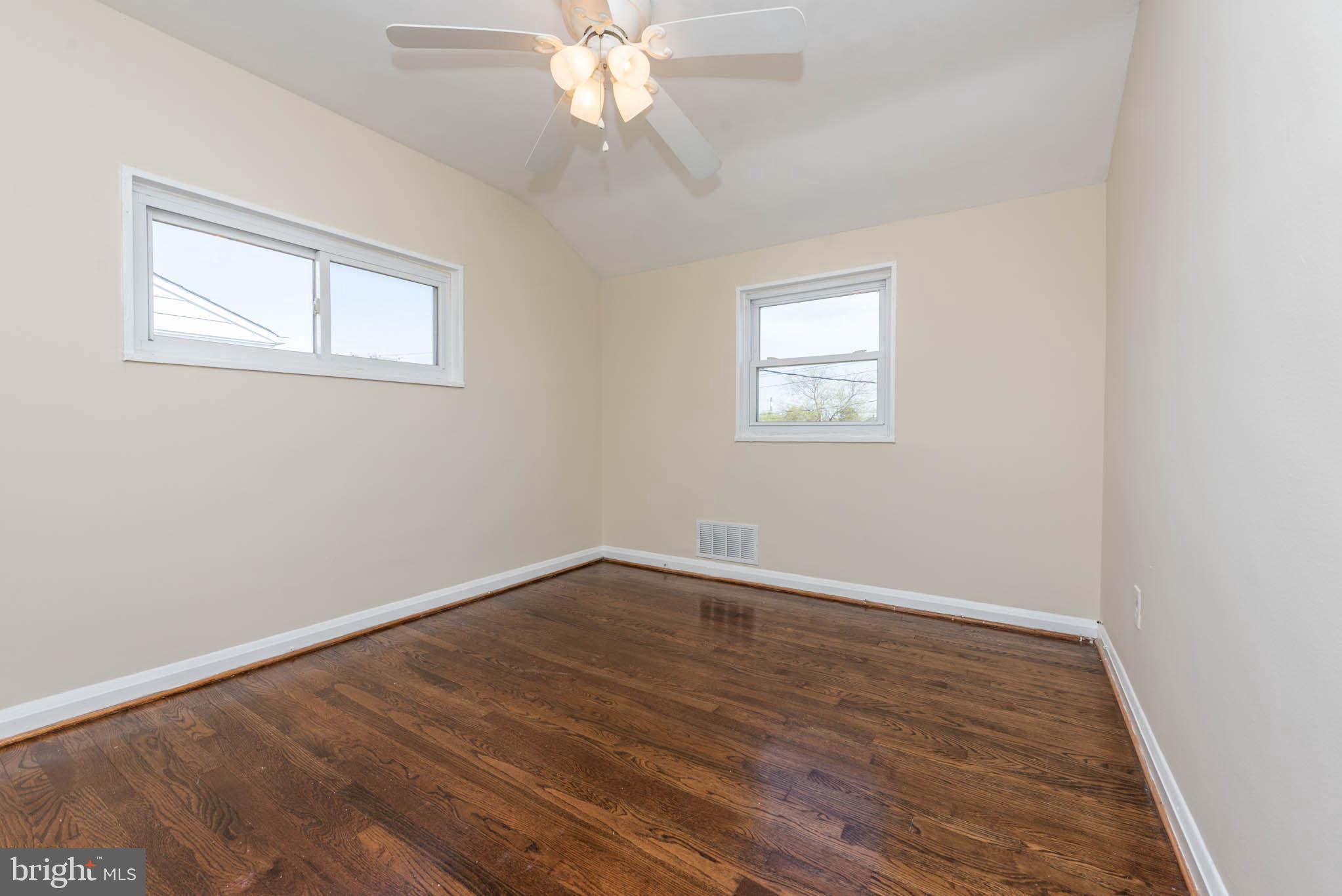 3300 Wallford Drive Baltimore, MD 21222 - Photo 13 of 31 a view of an empty room with wooden floor and a window