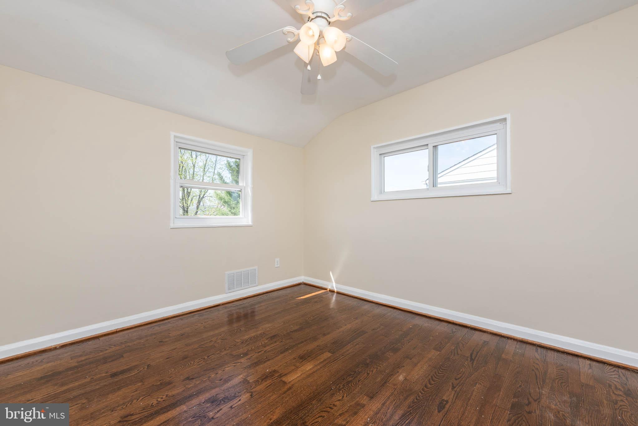 3300 Wallford Drive Baltimore, MD 21222 - Photo 14 of 31 a view of a room with wooden floor and window
