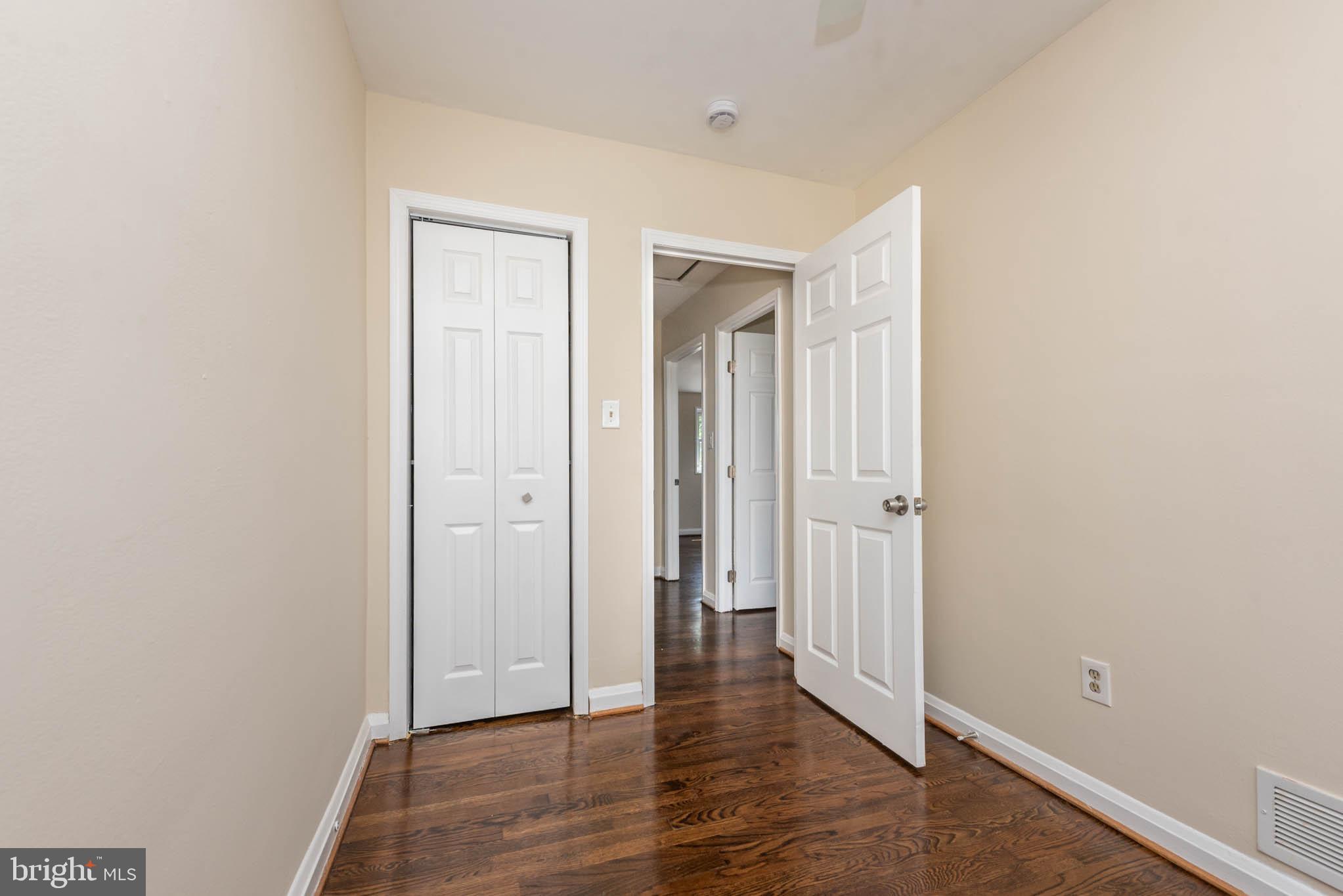 3300 Wallford Drive Baltimore, MD 21222 - Photo 17 of 31 an empty room with wooden floor & closet area