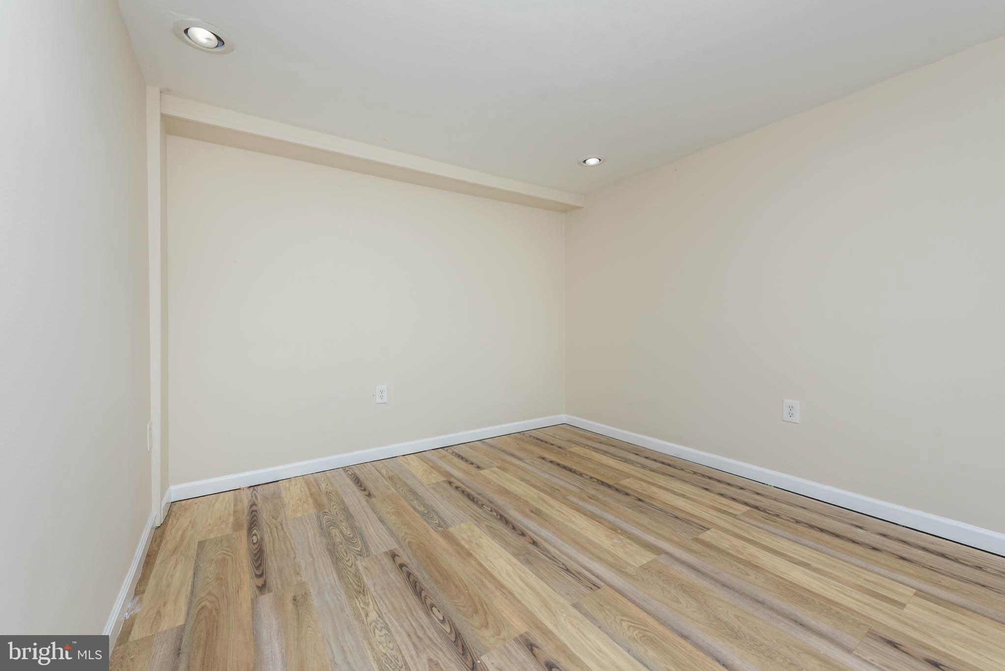 3300 Wallford Drive Baltimore, MD 21222 - Photo 19 of 31 a view of room with wooden floor