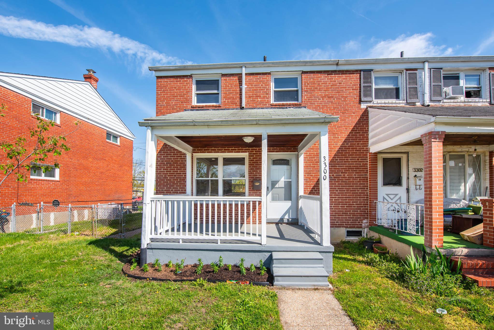 3300 Wallford Drive Baltimore, MD 21222 - Photo 24 of 31 a front view of a house with a yard