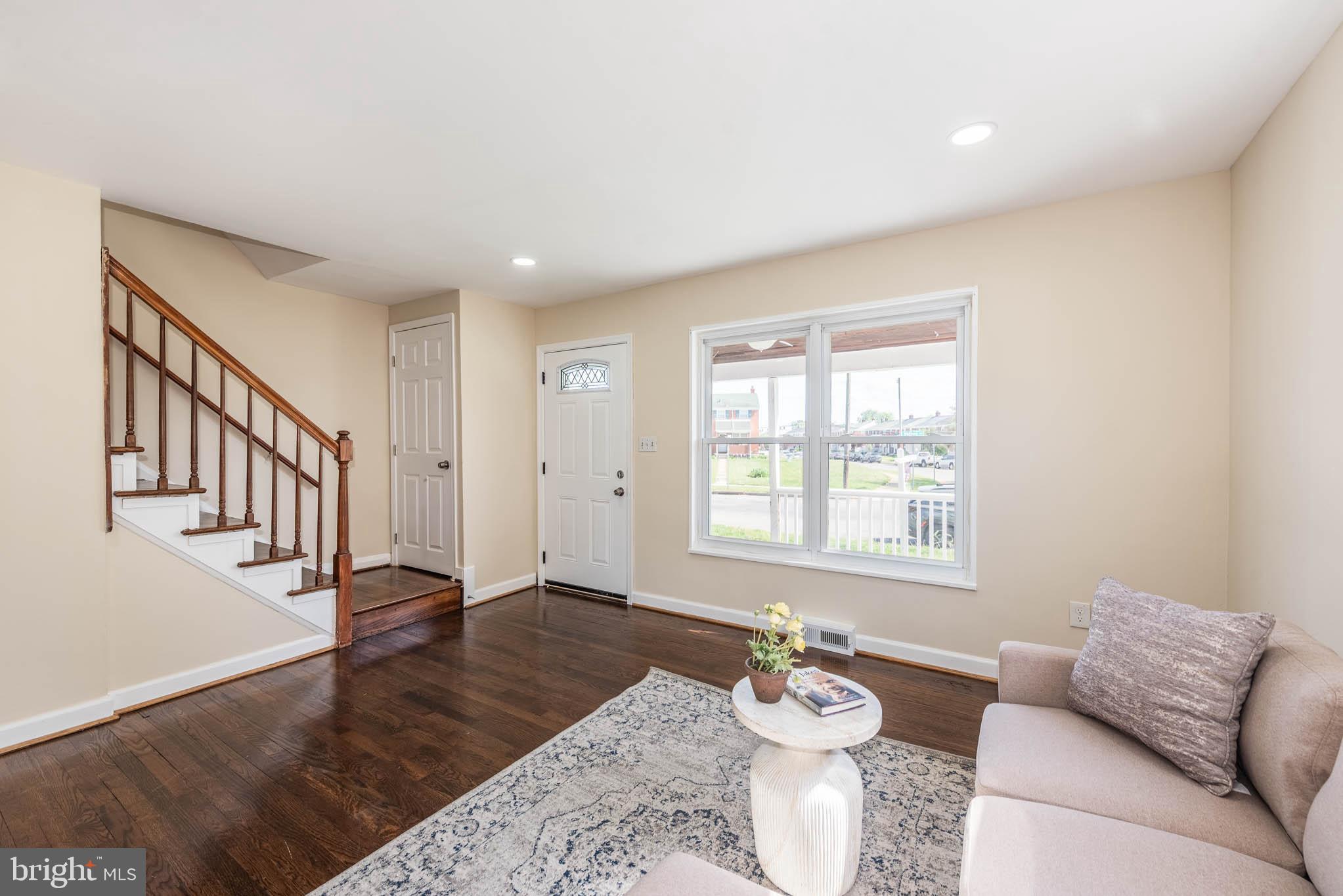3300 Wallford Drive Baltimore, MD 21222 - Photo 5 of 31 a living room with furniture and wooden floor