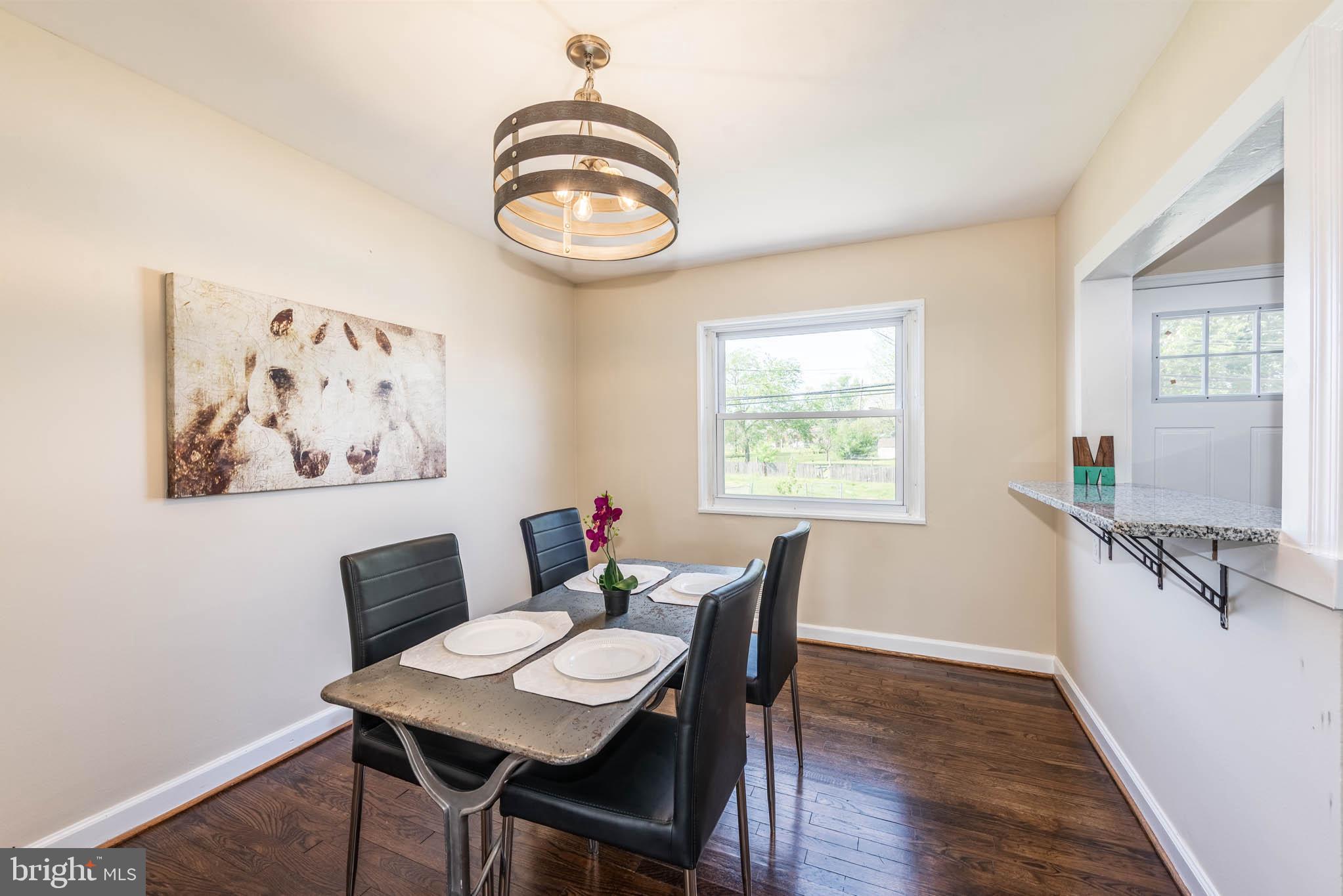 3300 Wallford Drive Baltimore, MD 21222 - Photo 6 of 31 a view of a dining room with furniture and wooden floor