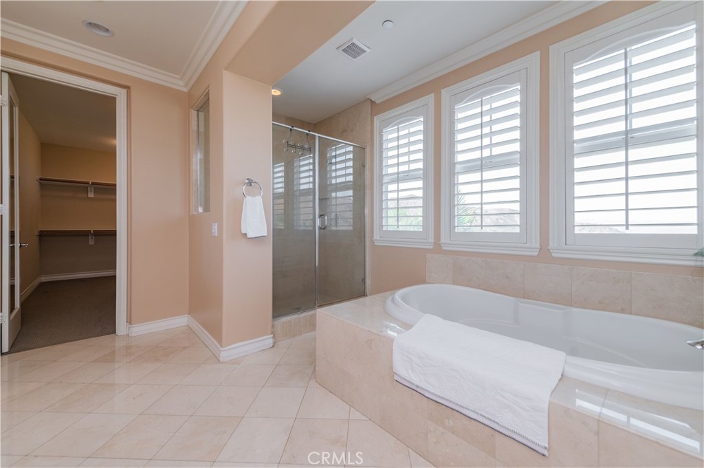 2148 Sageleaf Circle Corona, CA 92882 - Photo 18 of 41 a spacious bathroom with a bathtub and a shower