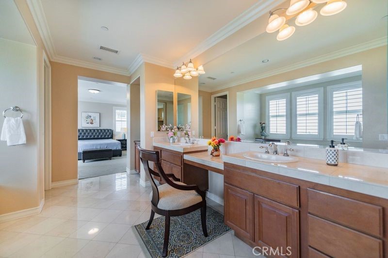 2148 Sageleaf Circle Corona, CA 92882 - Photo 19 of 41 a dining hall with stainless steel appliances kitchen island granite countertop a sink and cabinets