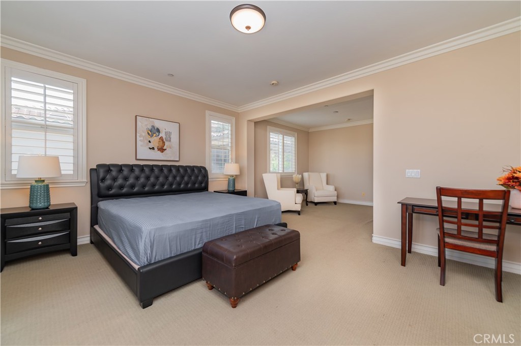 2148 Sageleaf Circle Corona, CA 92882 - Photo 20 of 41 a spacious bedroom with a bed and a desk
