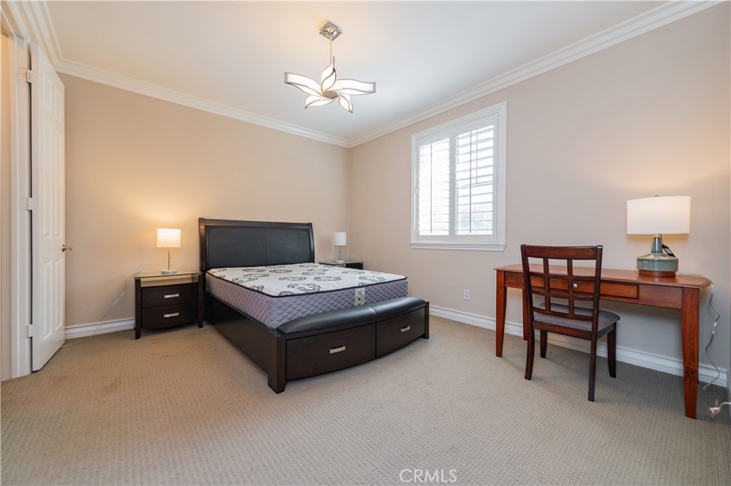 2148 Sageleaf Circle Corona, CA 92882 - Photo 25 of 41 a living room with furniture and a chandelier