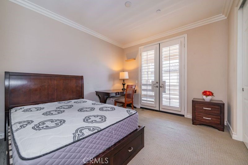 2148 Sageleaf Circle Corona, CA 92882 - Photo 26 of 41 a bed sitting in a bedroom next to a window