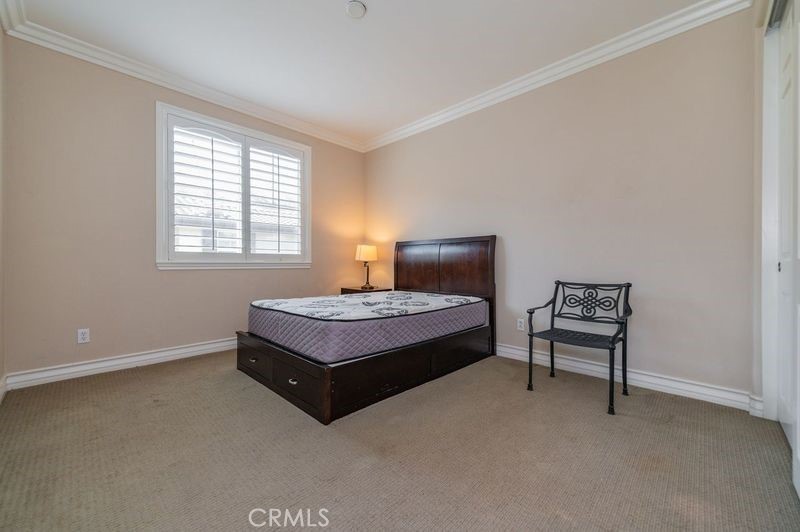 2148 Sageleaf Circle Corona, CA 92882 - Photo 27 of 41 a bedroom with a bed and a window
