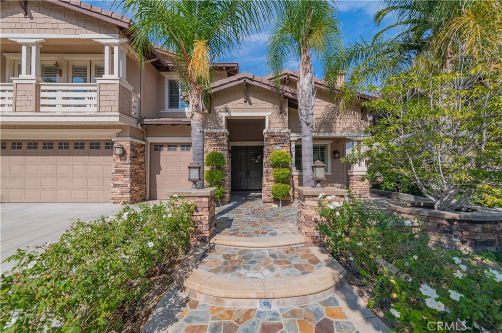 2148 Sageleaf Circle Corona, CA 92882 - Photo 3 of 41 a front view of a house with a garden