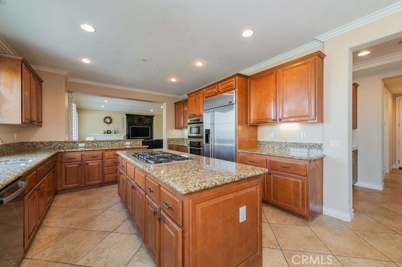2148 Sageleaf Circle Corona, CA 92882 - Photo 7 of 41 a kitchen with stainless steel appliances granite countertop a stove a sink dishwasher and a refrigerator