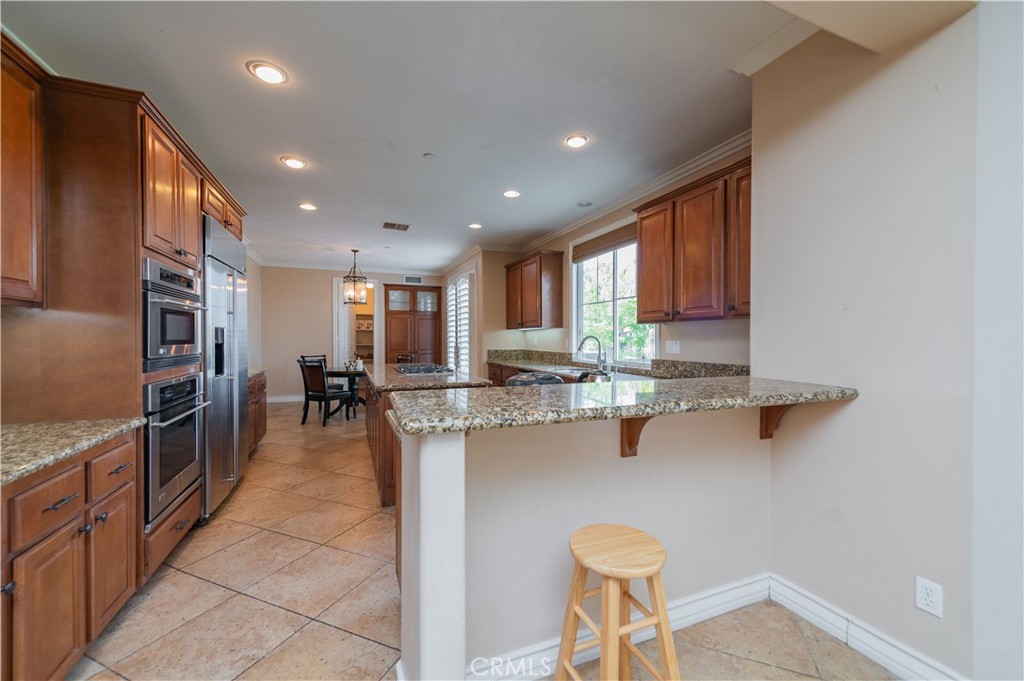 2148 Sageleaf Circle Corona, CA 92882 - Photo 9 of 41 a kitchen with stainless steel appliances granite countertop a refrigerator and cabinets