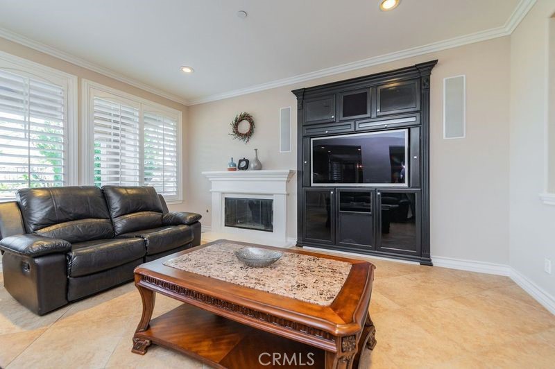2148 Sageleaf Circle Corona, CA 92882 - Photo 10 of 41 a living room with furniture and a fireplace