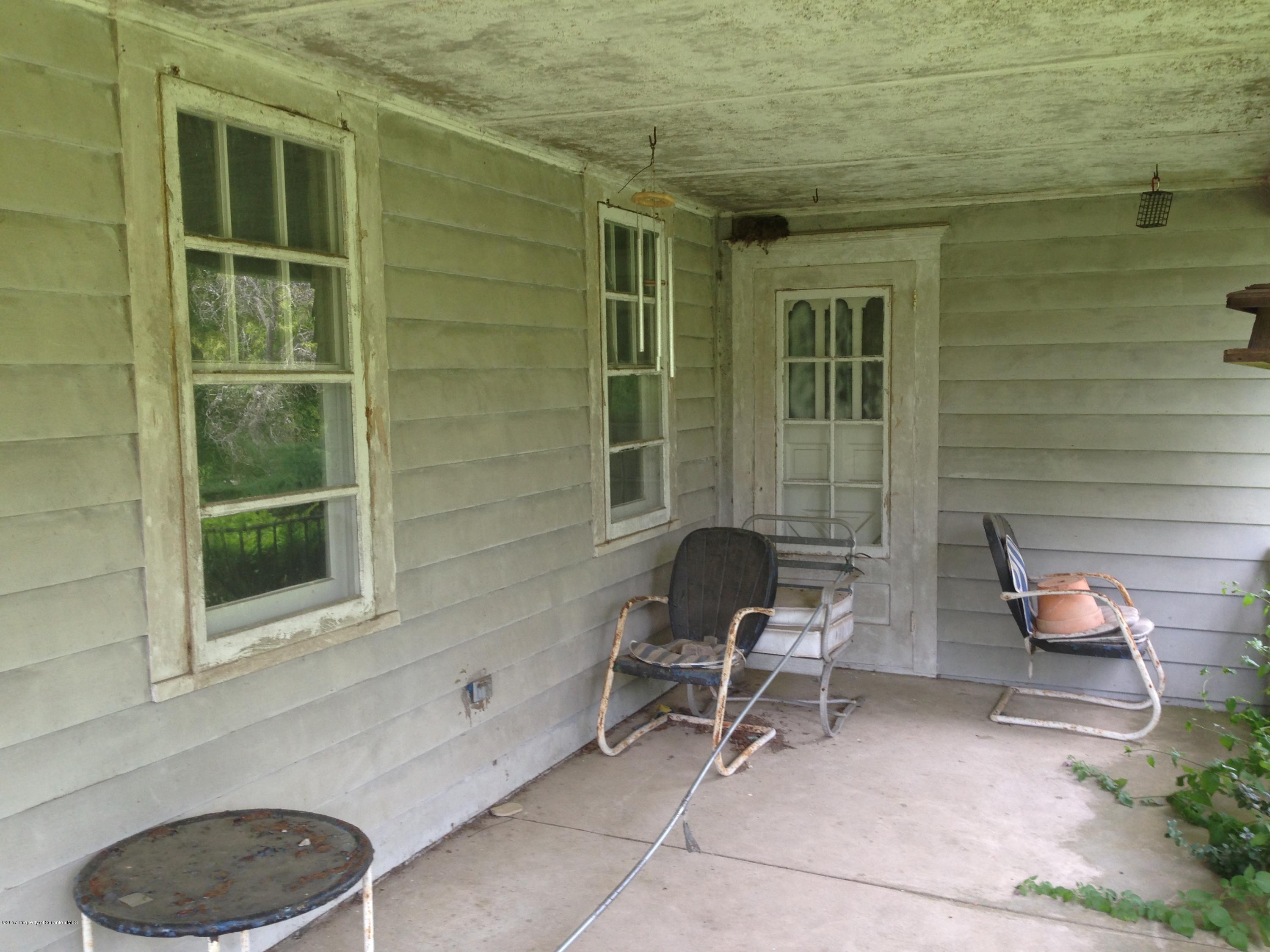 3391 Major Road Moscow, PA 18444 - Photo 3 of 58 a view of a two chairs in front of a house