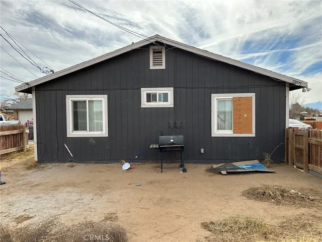a backyard of a house with seating space