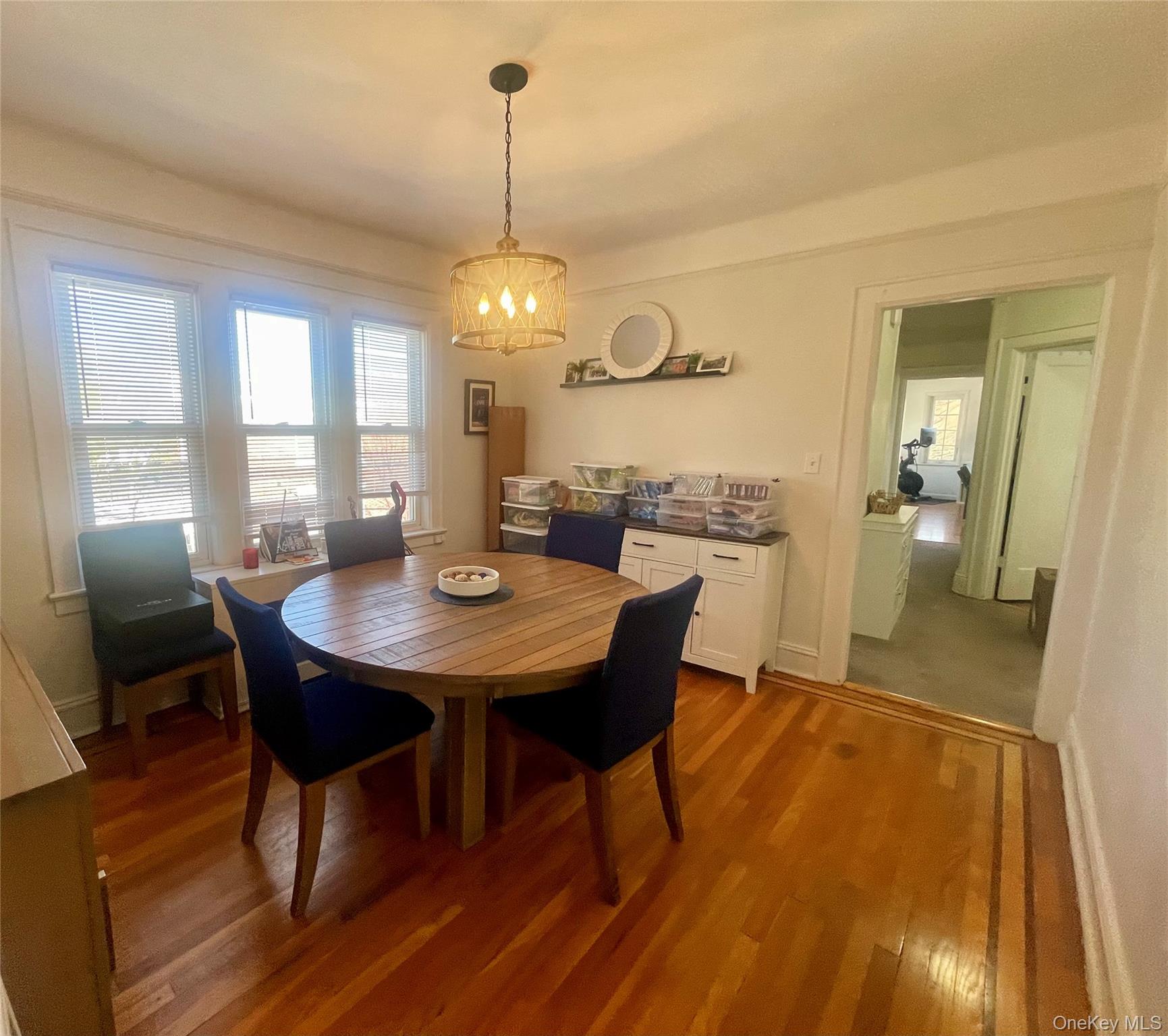 372 East 235th Street Bronx, NY 10470 - Photo 12 of 36 a view of a dining room with furniture window and wooden floor