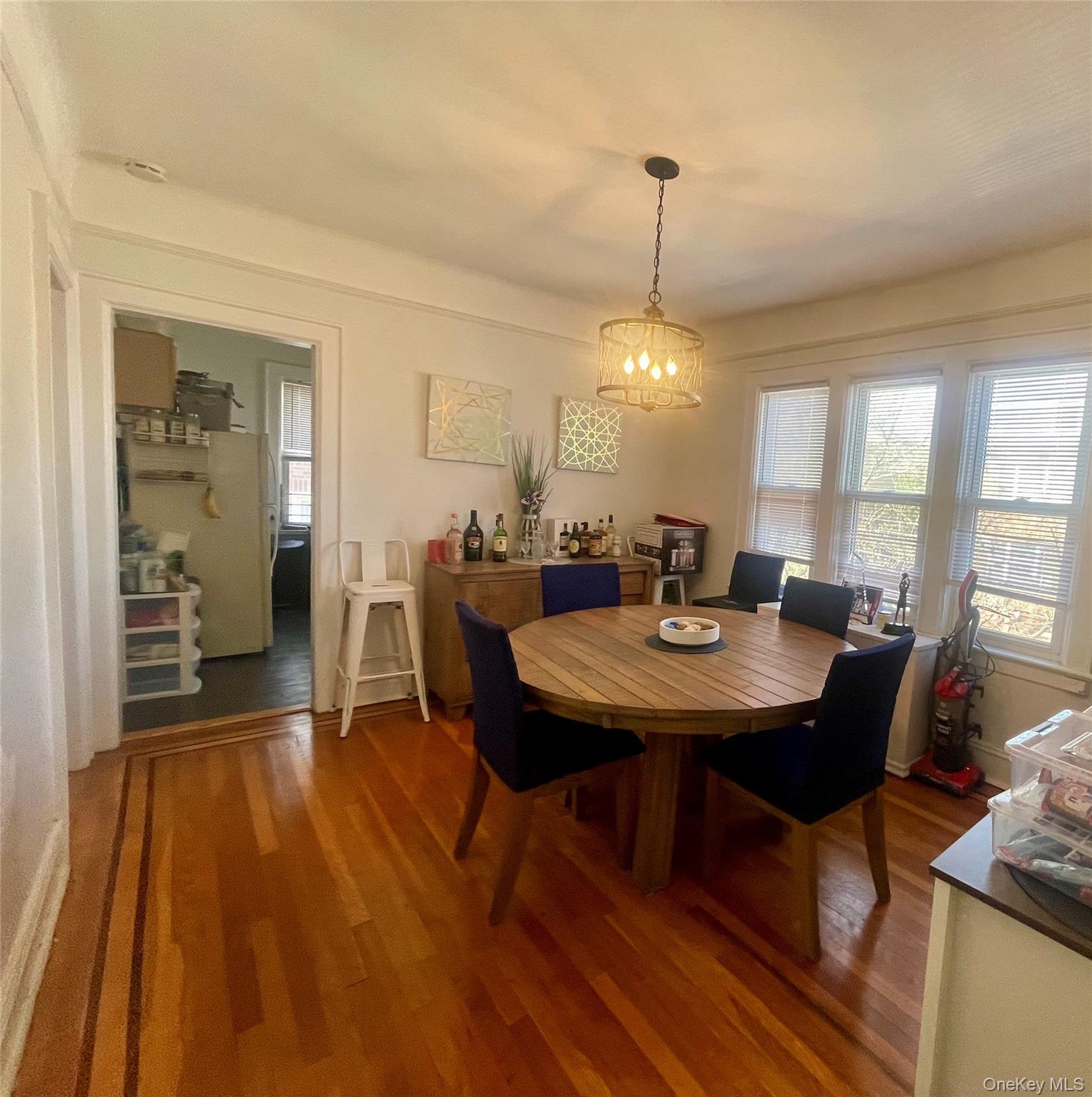 372 East 235th Street Bronx, NY 10470 - Photo 13 of 36 a view of a dining room with furniture window and wooden floor