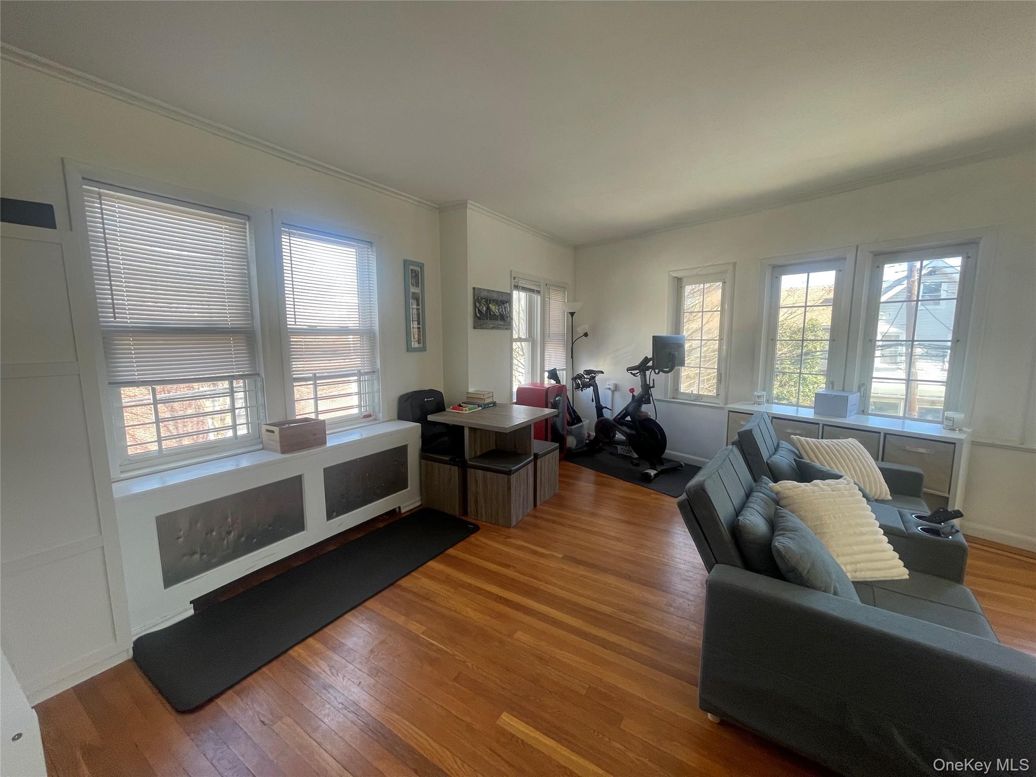 372 East 235th Street Bronx, NY 10470 - Photo 18 of 36 a living room with furniture and windows