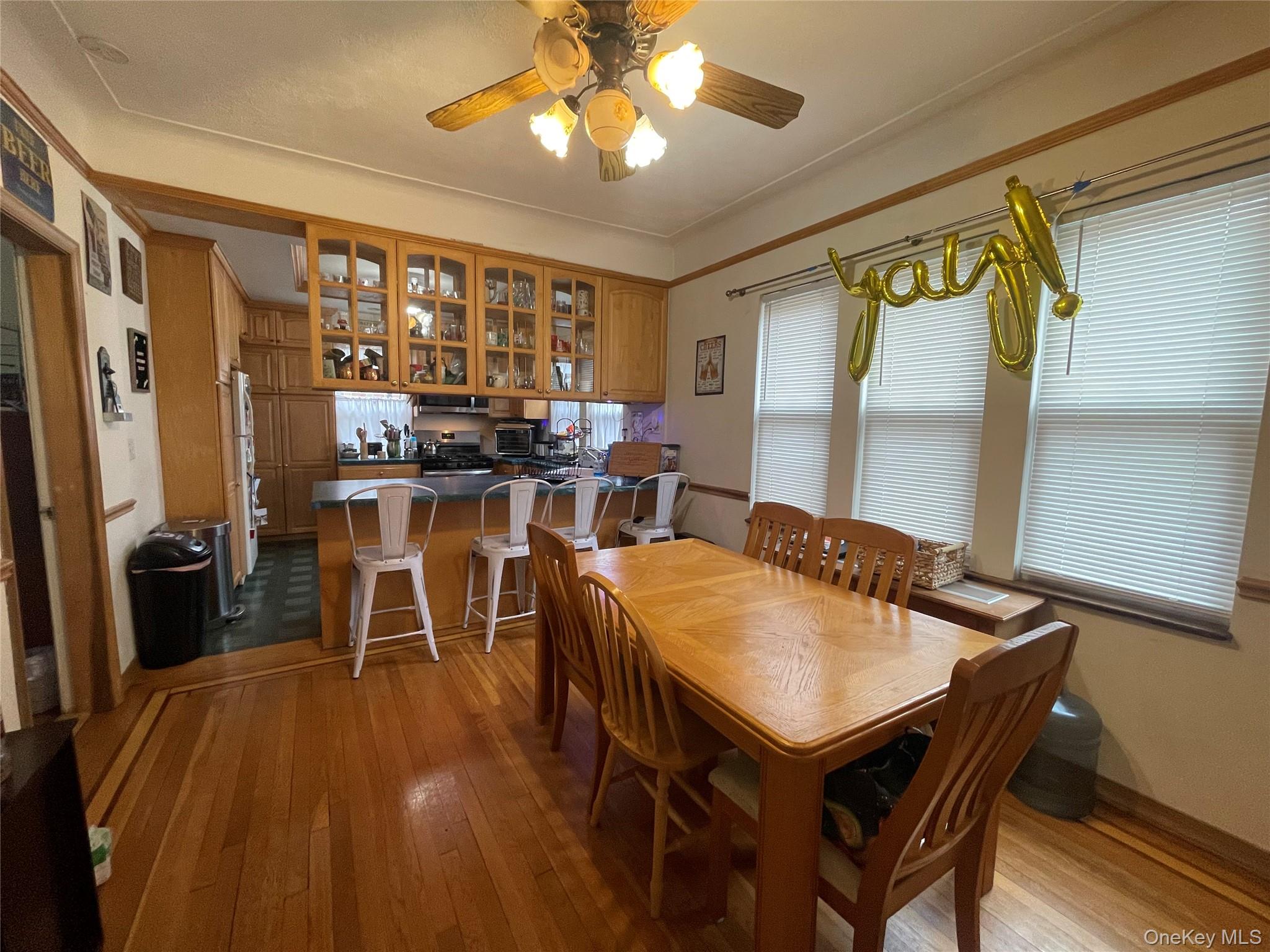 372 East 235th Street Bronx, NY 10470 - Photo 2 of 36 a view of a dining room with furniture and a chandelier